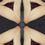 Raspberry Hamantaschen, triangle shaped  cookies for Purim, traditionally Jewish, filled with raspberry.