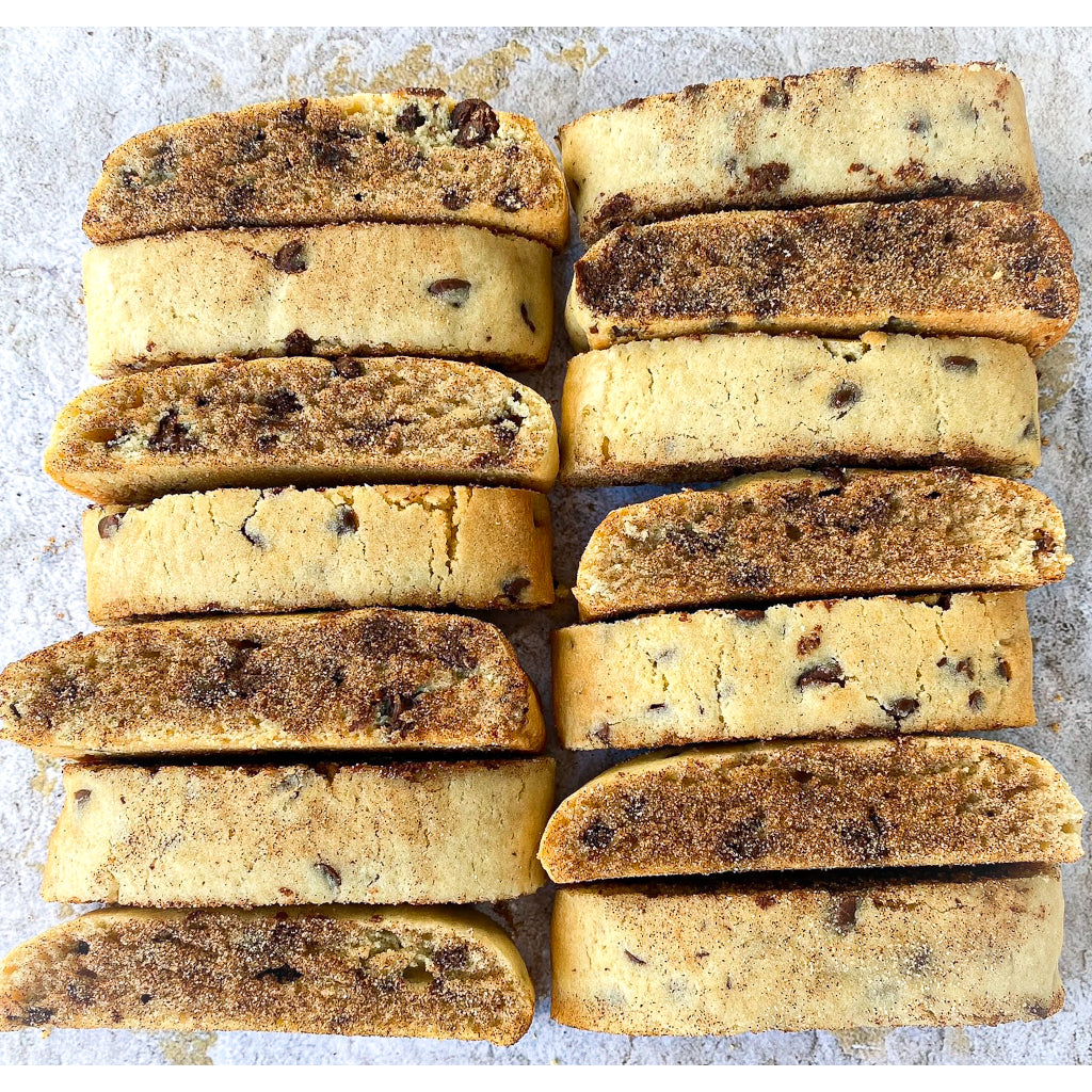 Chocolate Chip Mandel Bread, chewy like a cookie but shaped like a biscotti,filled with chocolate chip cookies and sprinkled with cinnamon sugar - created by Noshes By Sherri