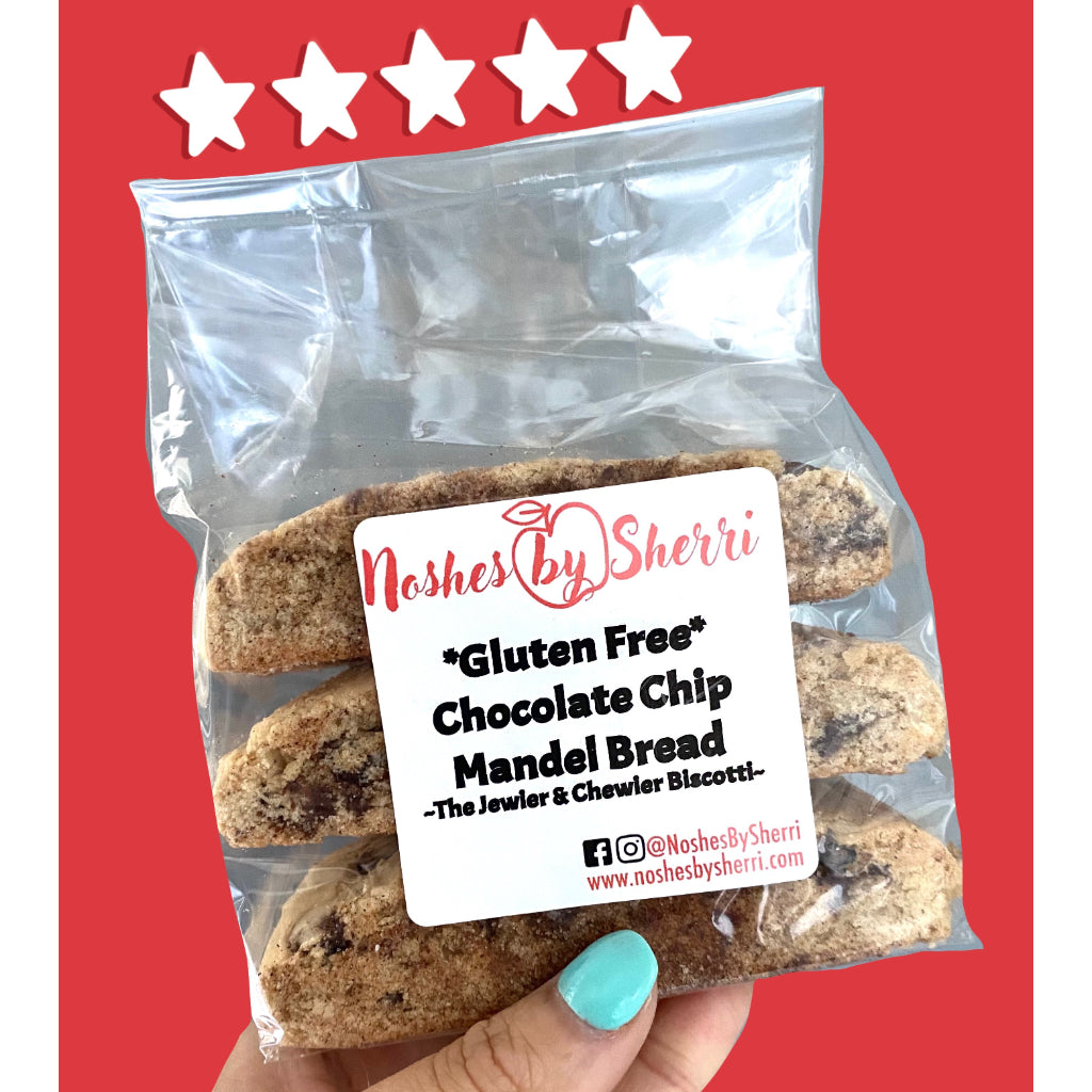Gluten Free Chocolate Chip Mandel Bread, shaped like a biscotti, chewy like a cookie, showing 3 pieces in a plastic packaging, and labeled by Noshes by Sherri